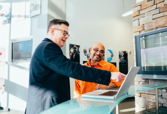 two people looking at onboarding materials in the office